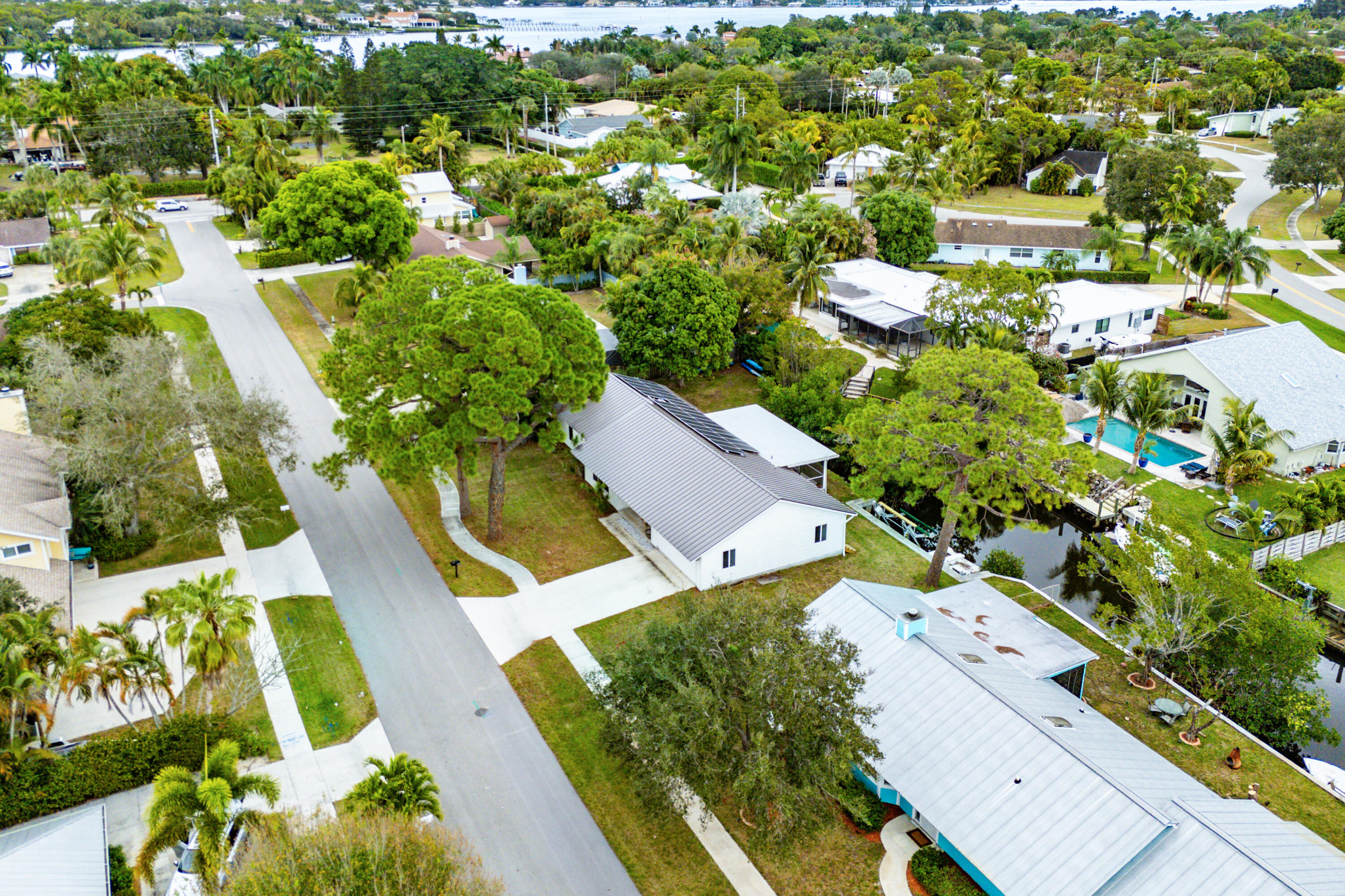 709 Warren Drive Jupiter, FL 33458 - Photo 46 of 56 an aerial view of residential houses with outdoor space