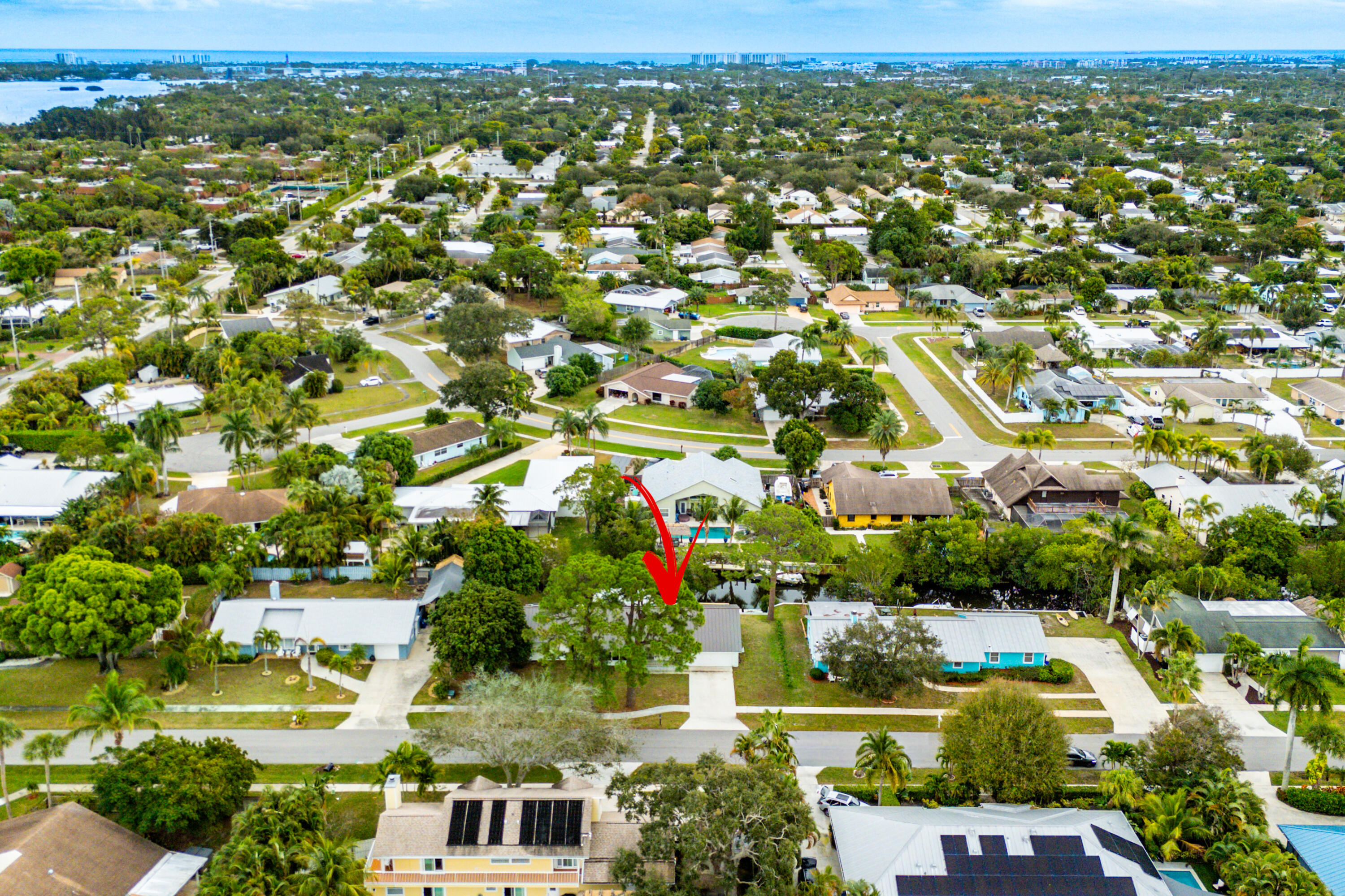 709 Warren Drive Jupiter, FL 33458 - Photo 49 of 56 an aerial view of residential houses with outdoor space and trees