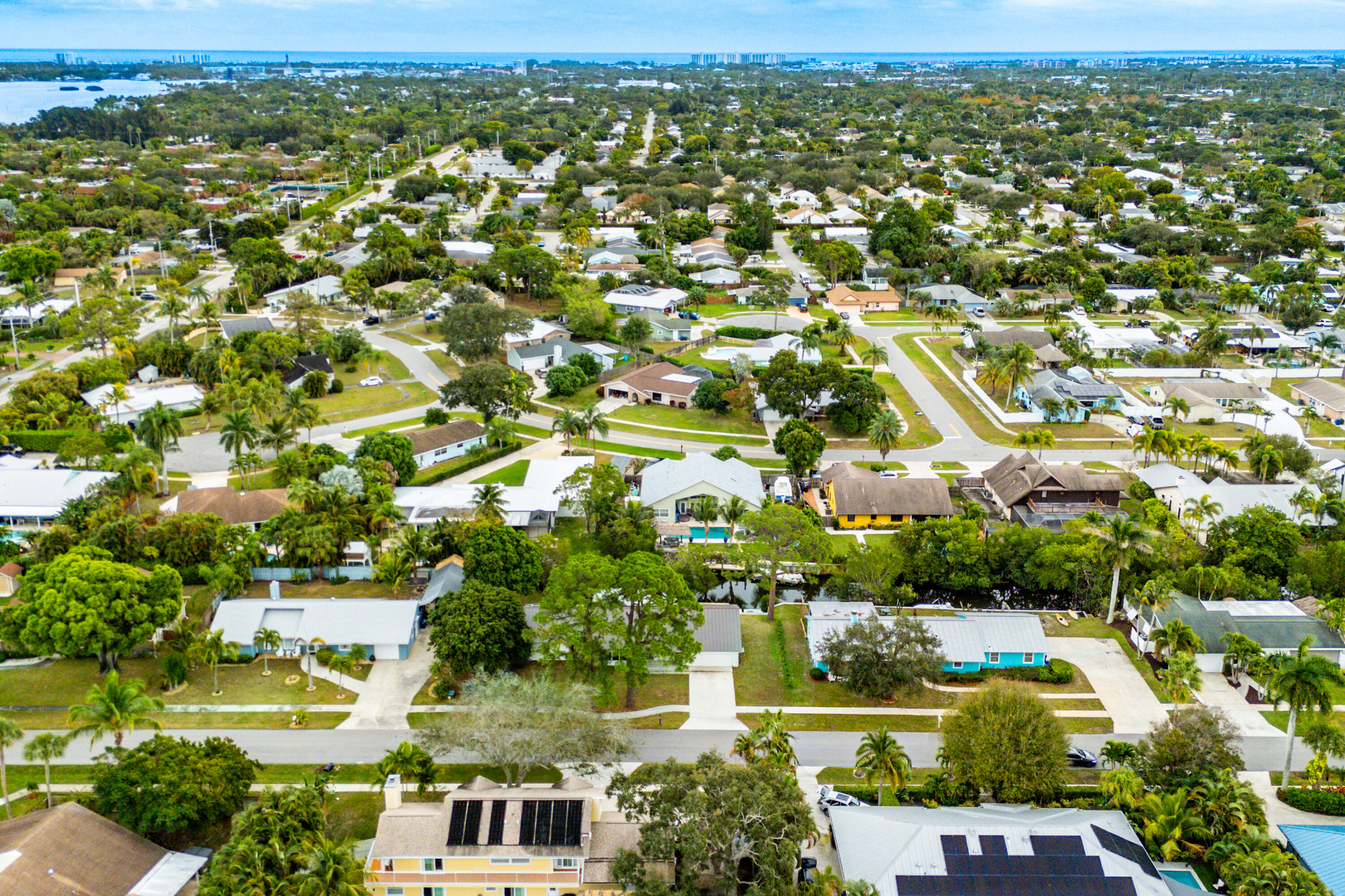 709 Warren Drive Jupiter, FL 33458 - Photo 50 of 56 an aerial view of residential houses with outdoor space and trees