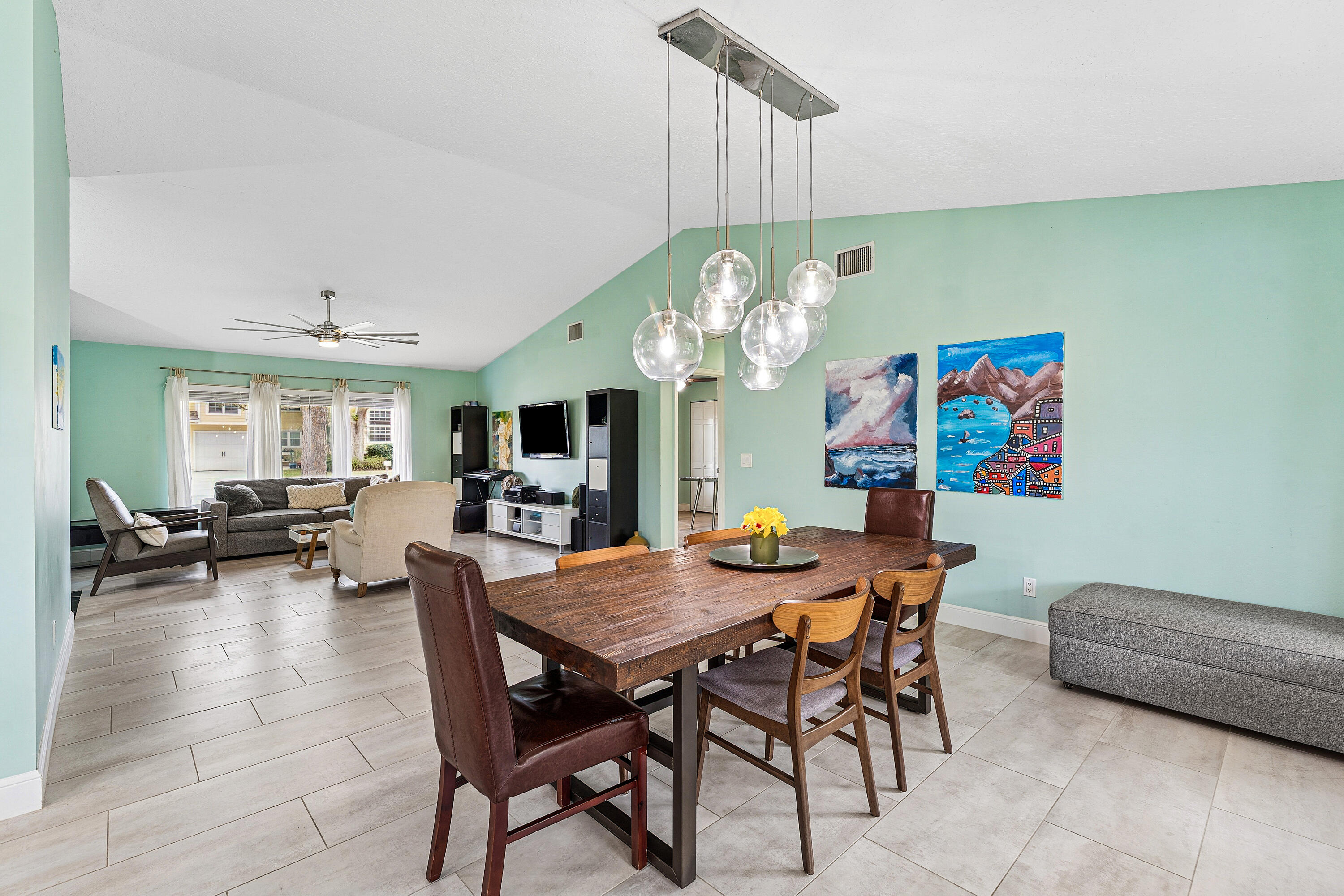 709 Warren Drive Jupiter, FL 33458 - Photo 9 of 56 a view of a dining room with furniture and a chandelier