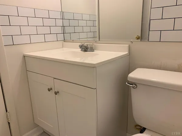 a bathroom with a sink and toilet