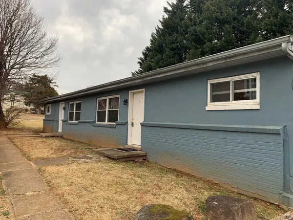 a house with trees in the background
