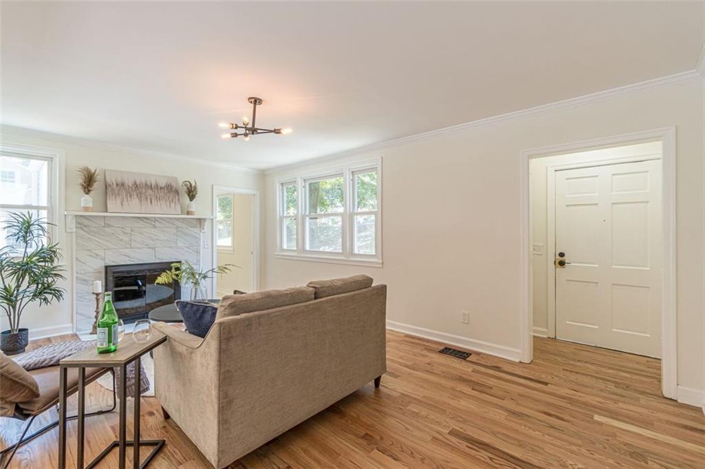 1226 Thomas Road Decatur, GA 30030 - Photo 15 of 38 a living room with furniture and a fireplace