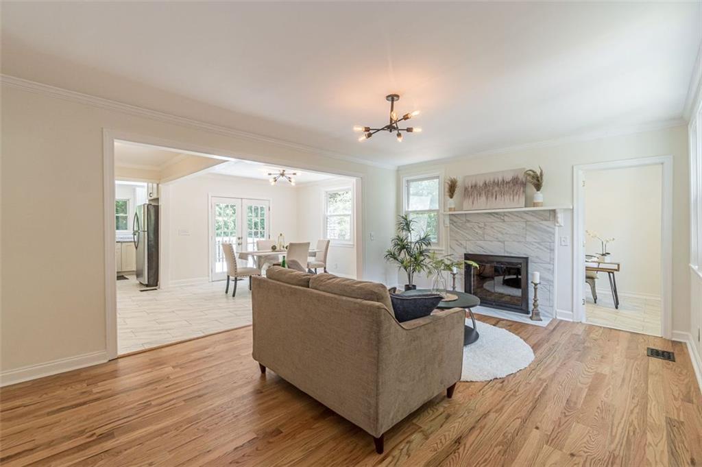 1226 Thomas Road Decatur, GA 30030 - Photo 17 of 38 a living room with furniture and a fireplace