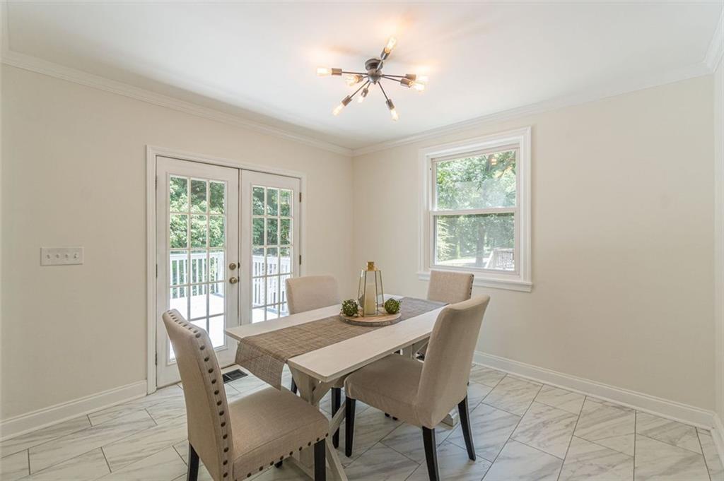 1226 Thomas Road Decatur, GA 30030 - Photo 21 of 38 a view of a dining room with furniture window and outside view