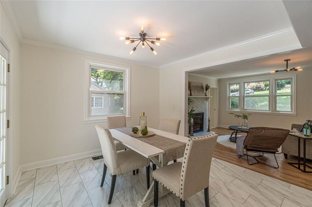 1226 Thomas Road Decatur, GA 30030 - Photo 23 of 38 a view of a dining room with furniture and chandelier