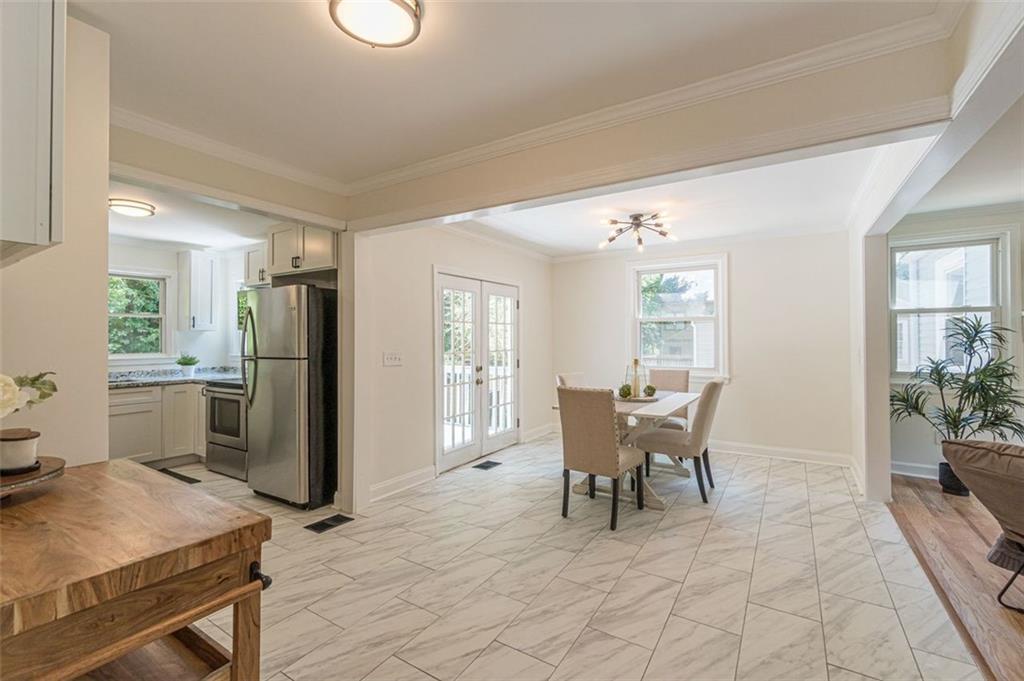 1226 Thomas Road Decatur, GA 30030 - Photo 26 of 38 a view of a dining room with furniture window and outside view