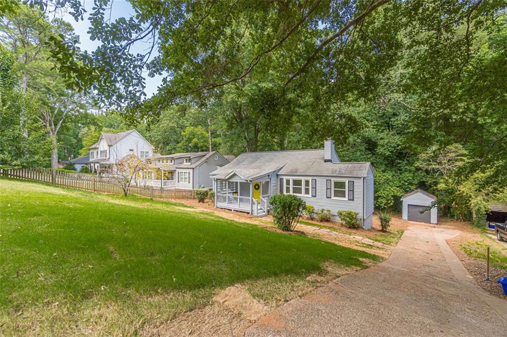 1226 Thomas Road Decatur, GA 30030 - Photo 3 of 38 front view of a house with a big yard