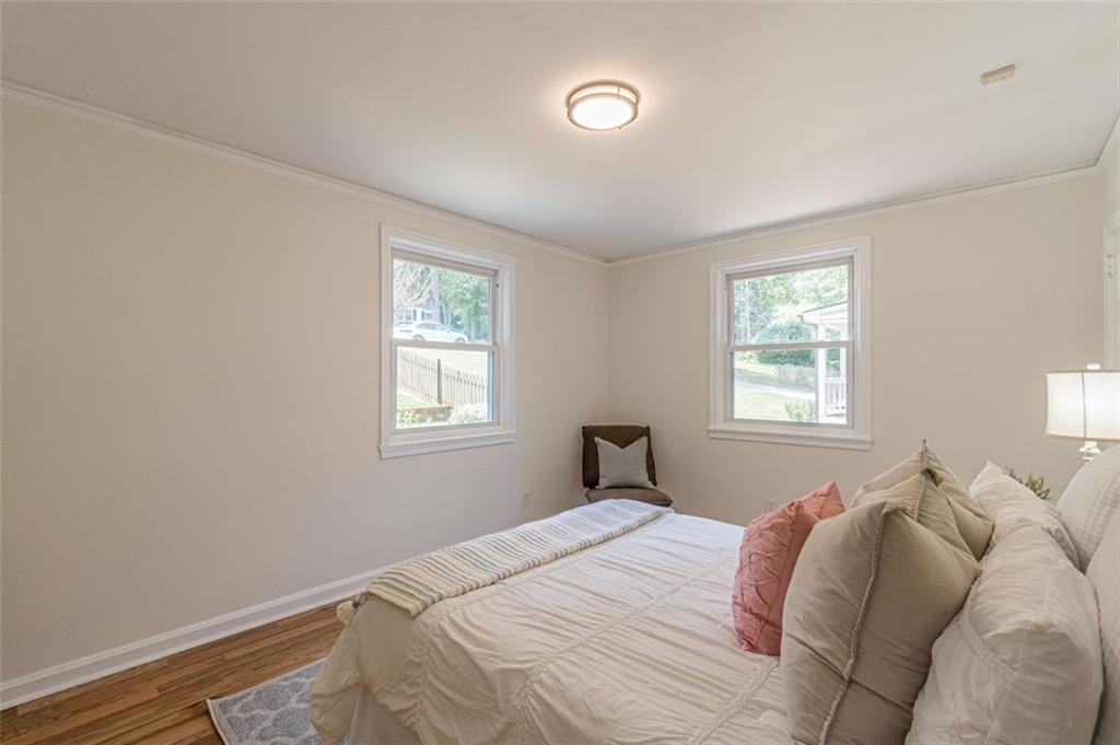 1226 Thomas Road Decatur, GA 30030 - Photo 33 of 38 a bedroom with a bed and a window