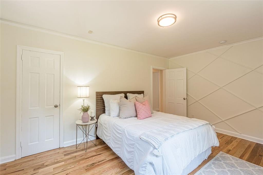 1226 Thomas Road Decatur, GA 30030 - Photo 35 of 38 a bedroom with a bed and a night stand