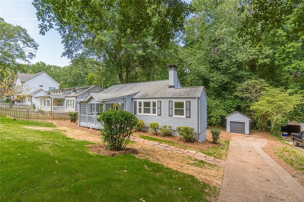 1226 Thomas Road Decatur, GA 30030 - Photo 4 of 38 a front view of a house with a garden
