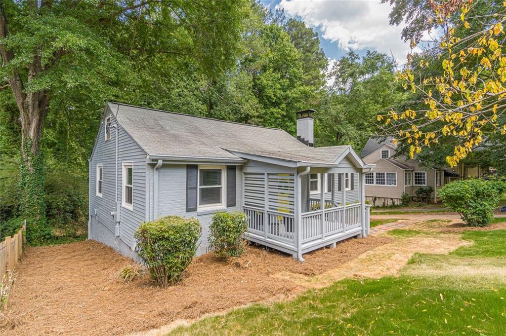 1226 Thomas Road Decatur, GA 30030 - Photo 5 of 38 a view of a house with a yard and large trees