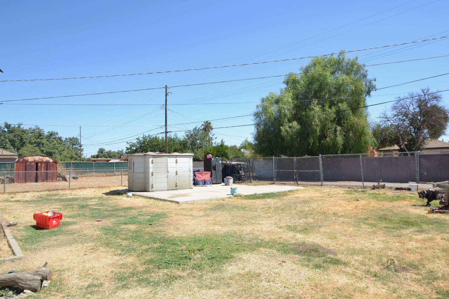 2555 South Lotus Avenue Fresno, CA 93706 - Photo 13 of 15 a view of a swimming pool with a yard