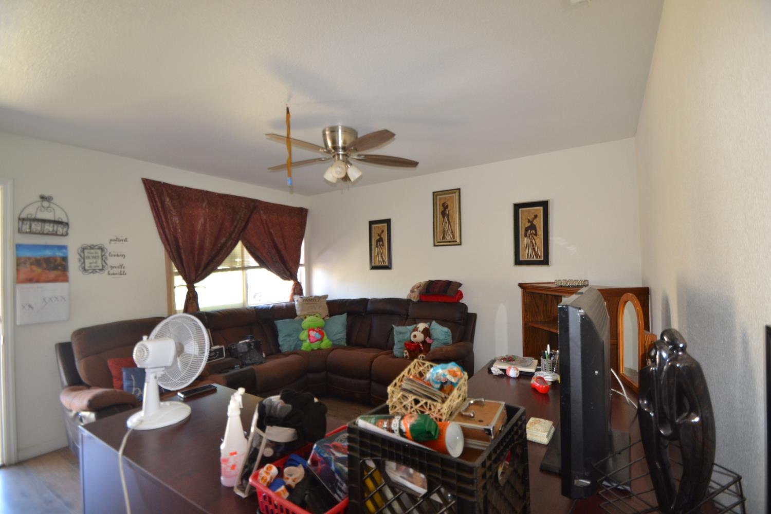 2555 South Lotus Avenue Fresno, CA 93706 - Photo 5 of 15 a living room with furniture and wooden floor