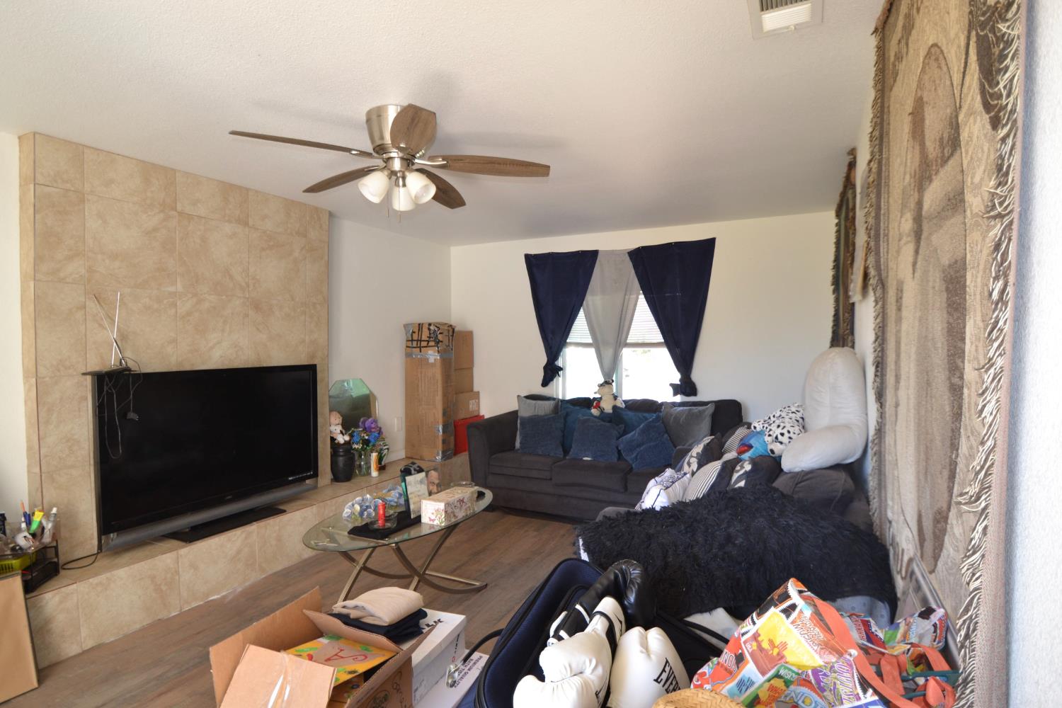 2555 South Lotus Avenue Fresno, CA 93706 - Photo 7 of 15 a living room with furniture and a fireplace