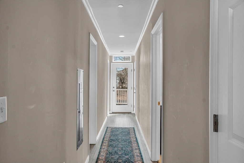 3 Elm Street, Unit 4 Boston, MA 02122 - Photo 9 of 24 a view of a hallway with wooden floor