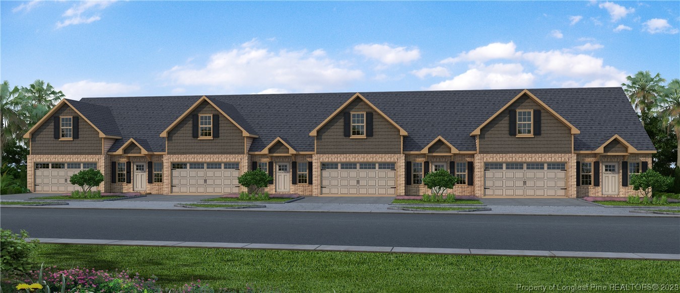 front view of a house next to a yard