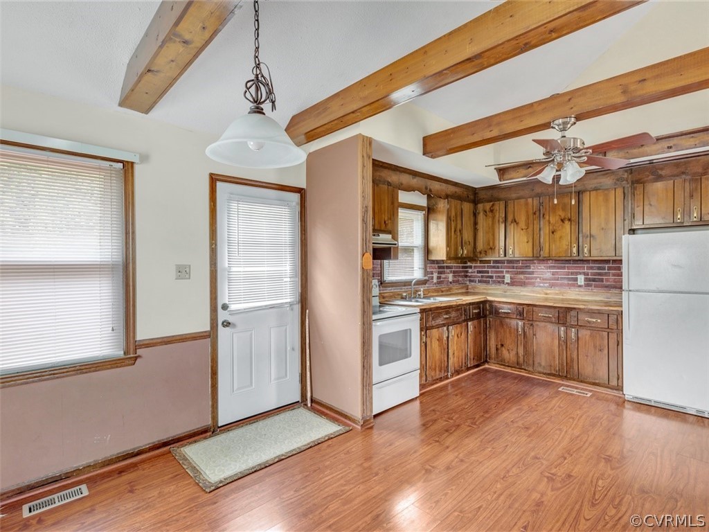 3124 Fielding Road Chester, VA 23831 - Photo 6 of 18 a kitchen with a refrigerator and a stove top oven