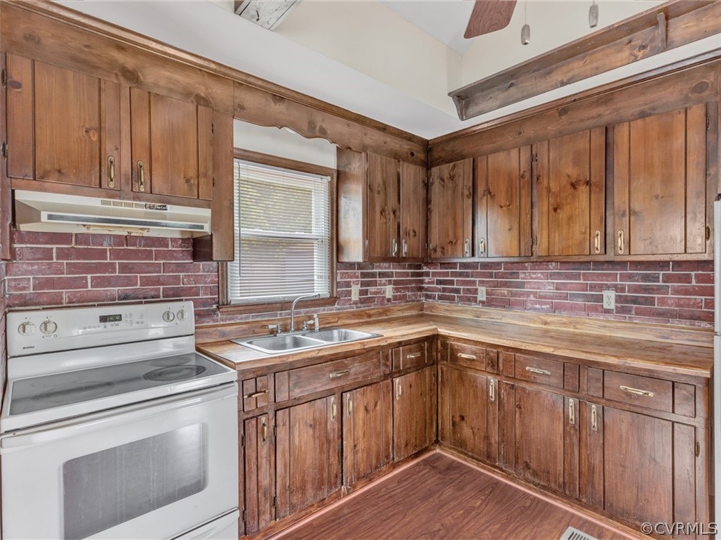 3124 Fielding Road Chester, VA 23831 - Photo 8 of 18 a kitchen with stainless steel appliances granite countertop a sink stove and cabinets