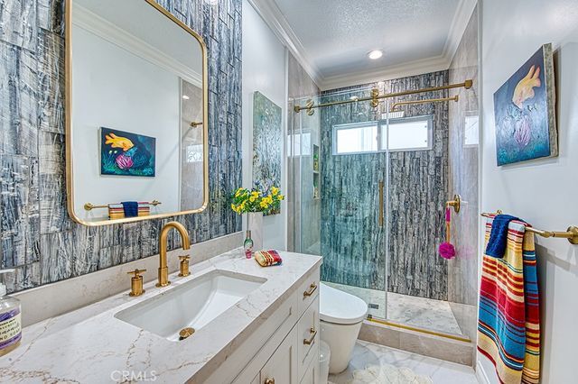 a hallway with wooden floor table and chairs