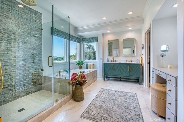 a bathroom with double vanity sink and a mirror