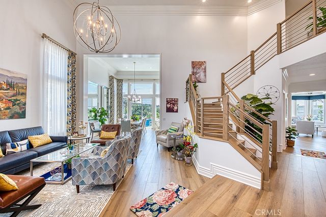 a living room with furniture wooden floor and a table