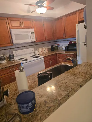 a kitchen with a sink and a stove