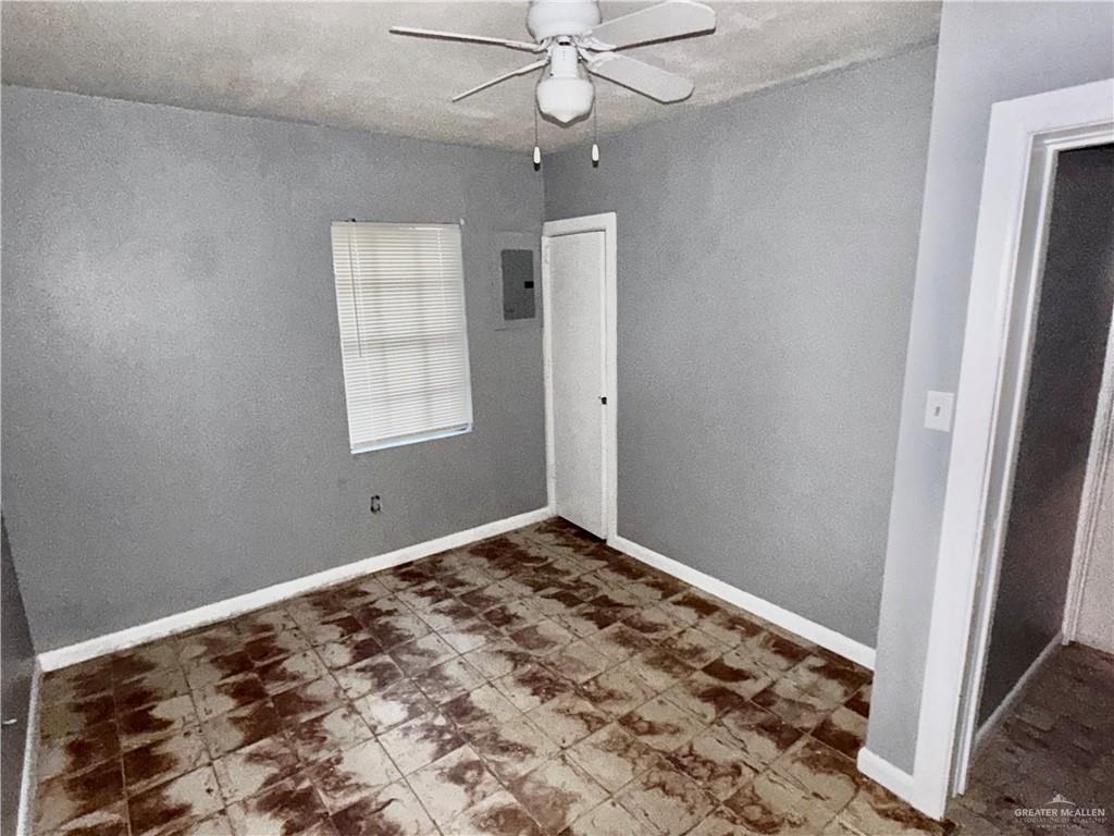 204 Ramon Private Road Mission, TX 78572 - Photo 8 of 11 Room featuring a window with horizontal blinds, a ceiling fan, and grey painted walls