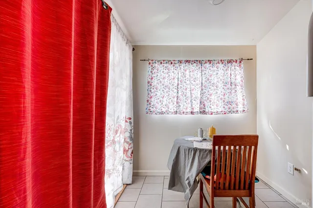 a view of a balcony with furniture and a window