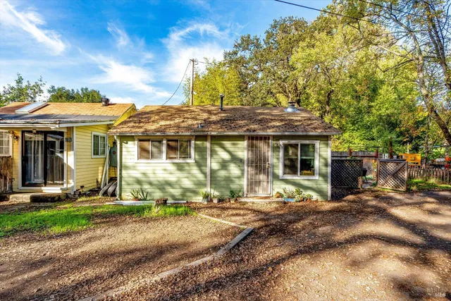 a front view of a house with garden and porch