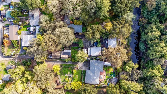 an aerial view of a houses with yard