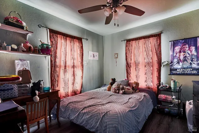 a bedroom with bed and a chandelier
