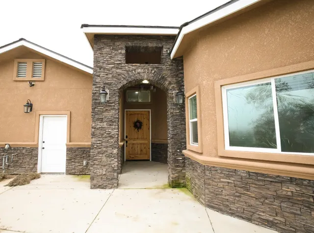 a front view of a house with a garage