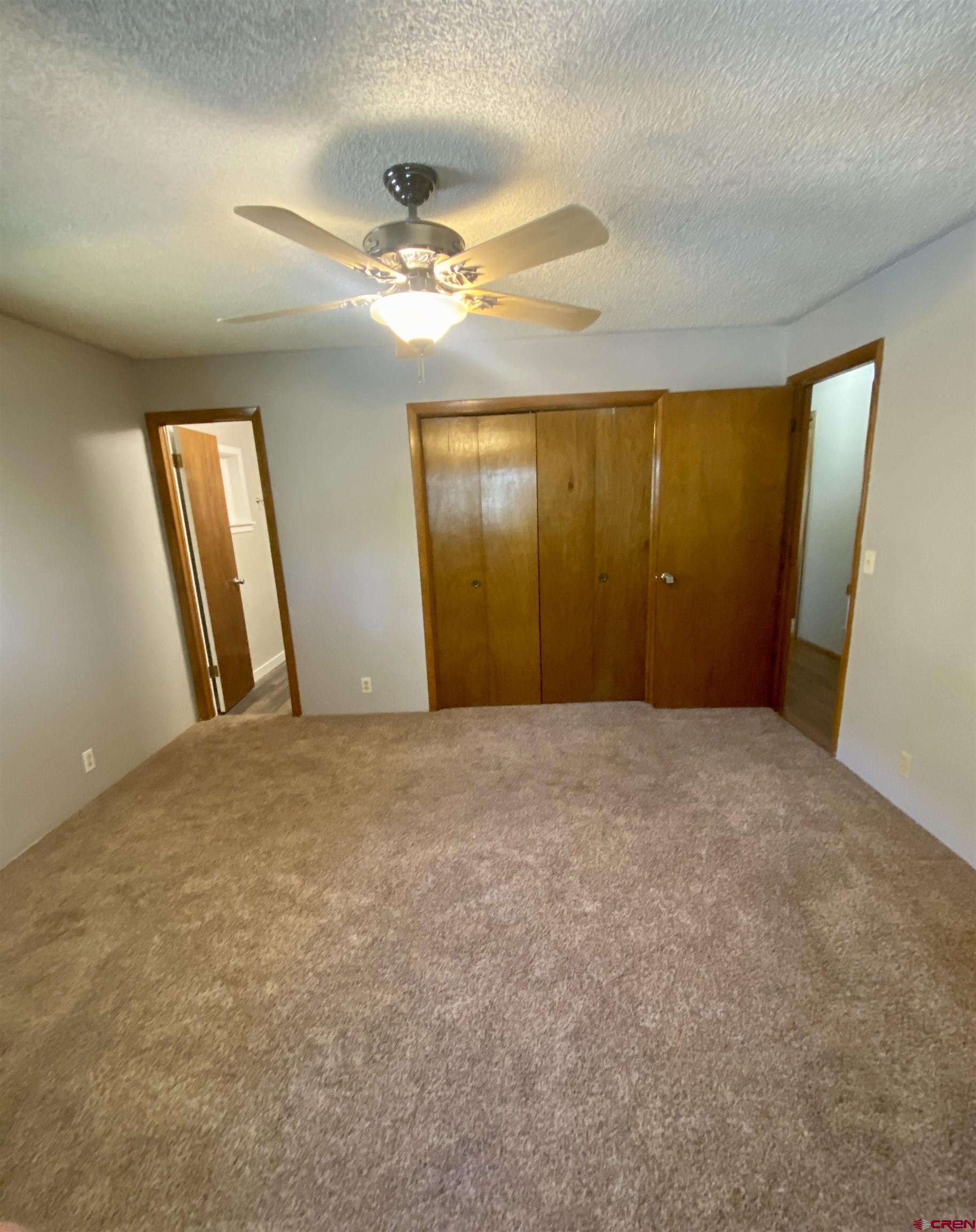 21430 Highway 550 Ridgway, CO 81432 - Photo 20 of 35 an empty room with windows and bathroom