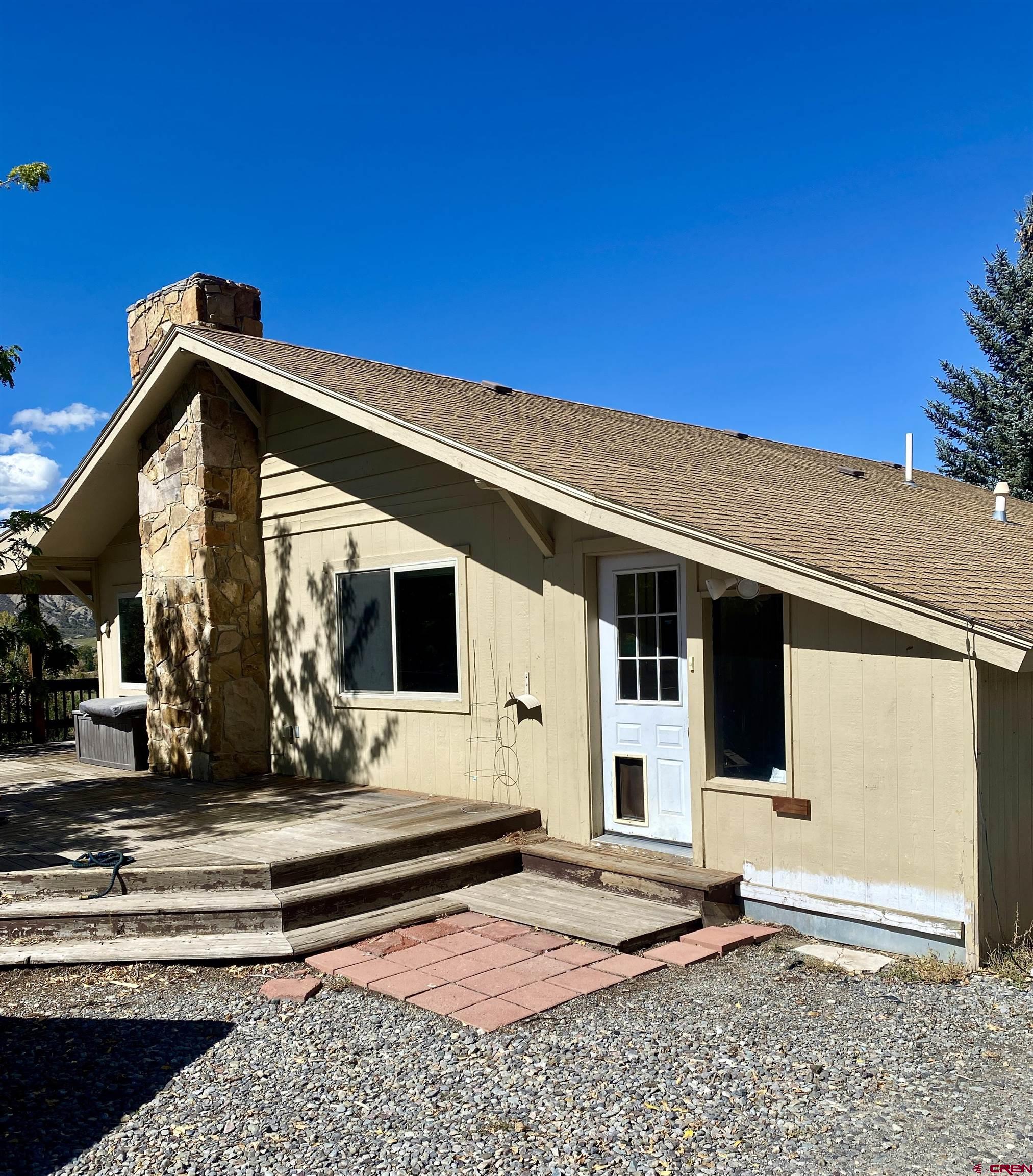 21430 Highway 550 Ridgway, CO 81432 - Photo 2 of 35 a front view of a house with windows