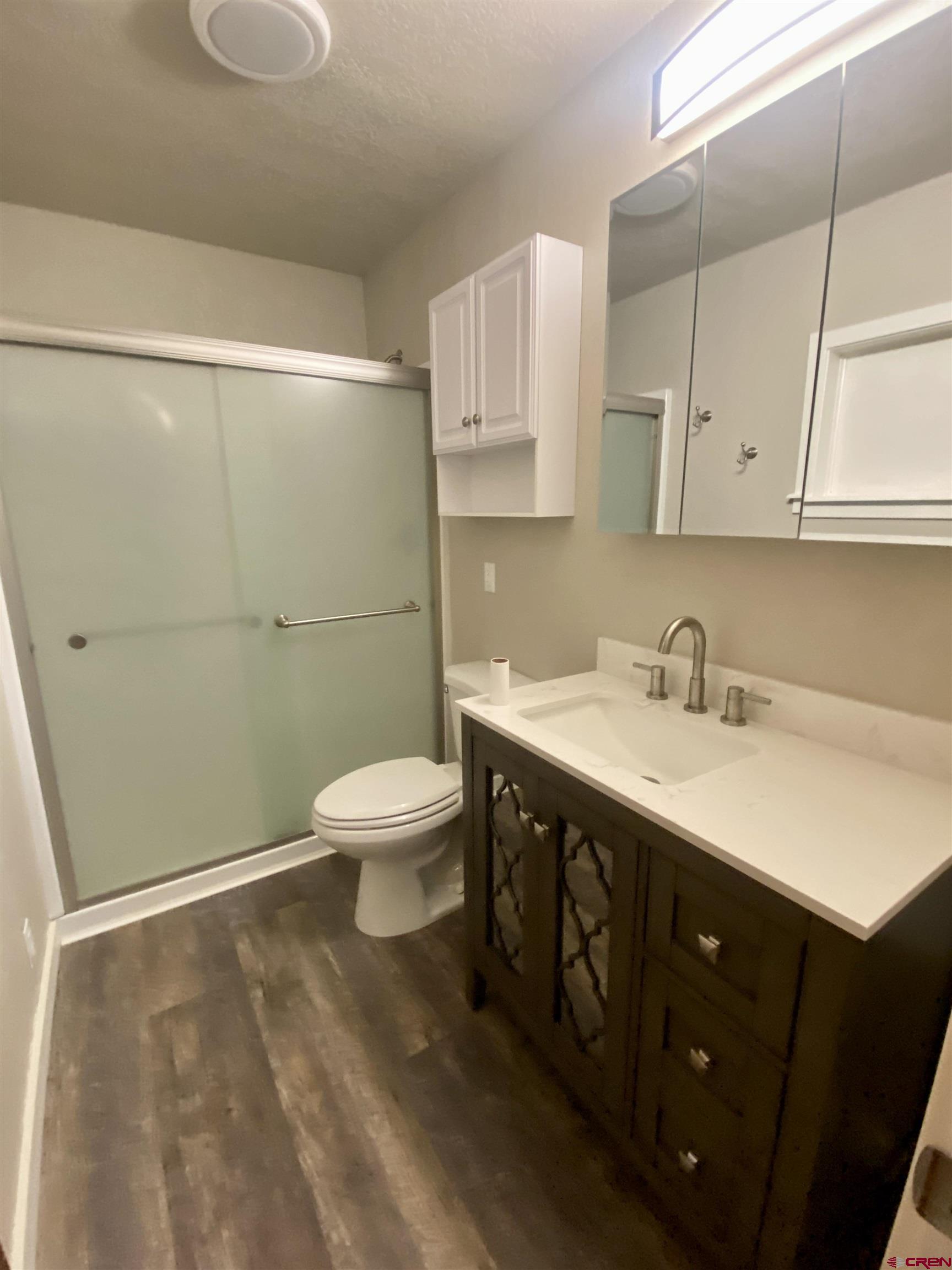 21430 Highway 550 Ridgway, CO 81432 - Photo 21 of 35 a spacious bathroom with a double vanity sink toilet and a mirror