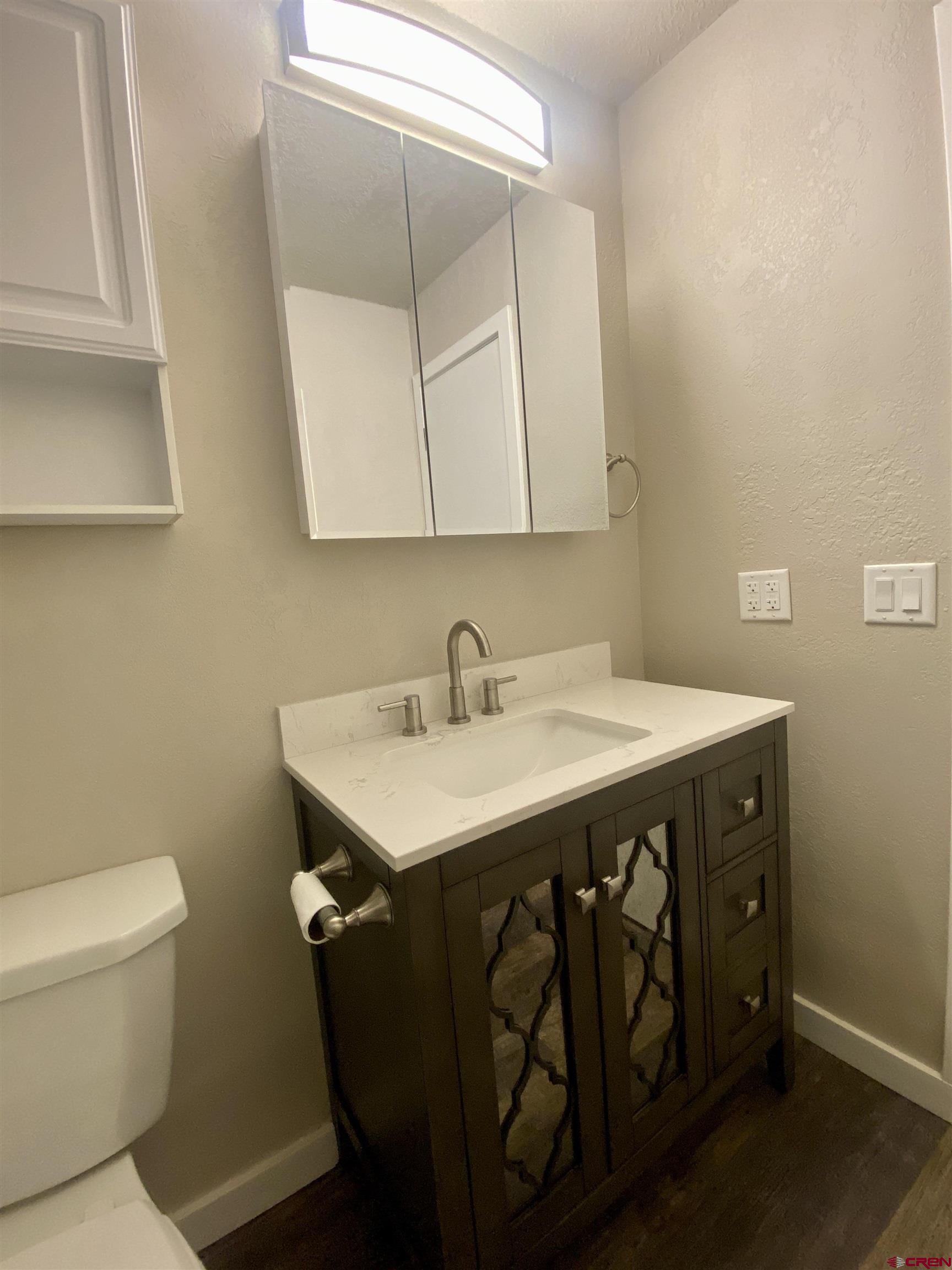 21430 Highway 550 Ridgway, CO 81432 - Photo 22 of 35 a bathroom with a sink and a toilet