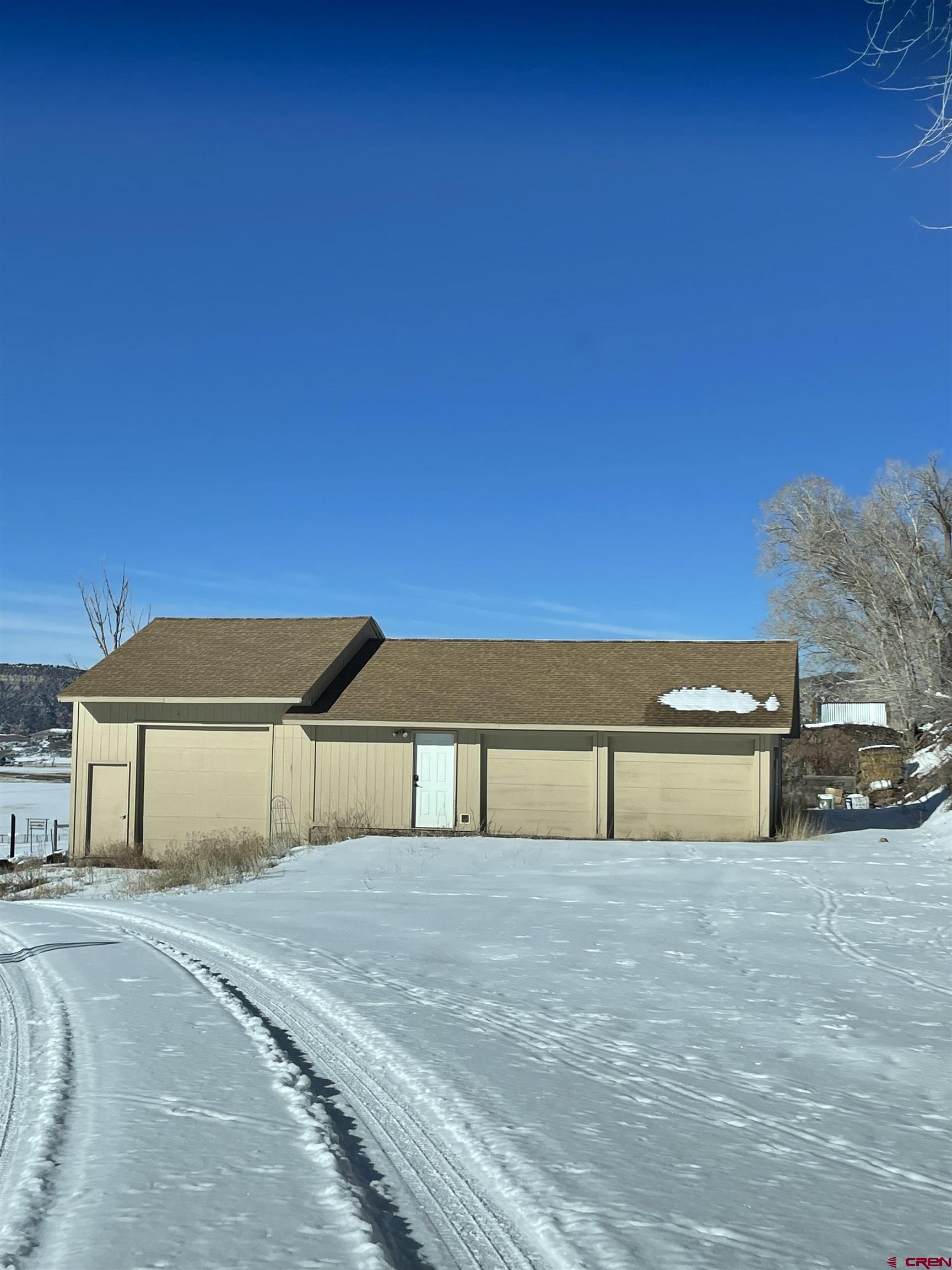 21430 Highway 550 Ridgway, CO 81432 - Photo 31 of 35 a front view of a house with a yard