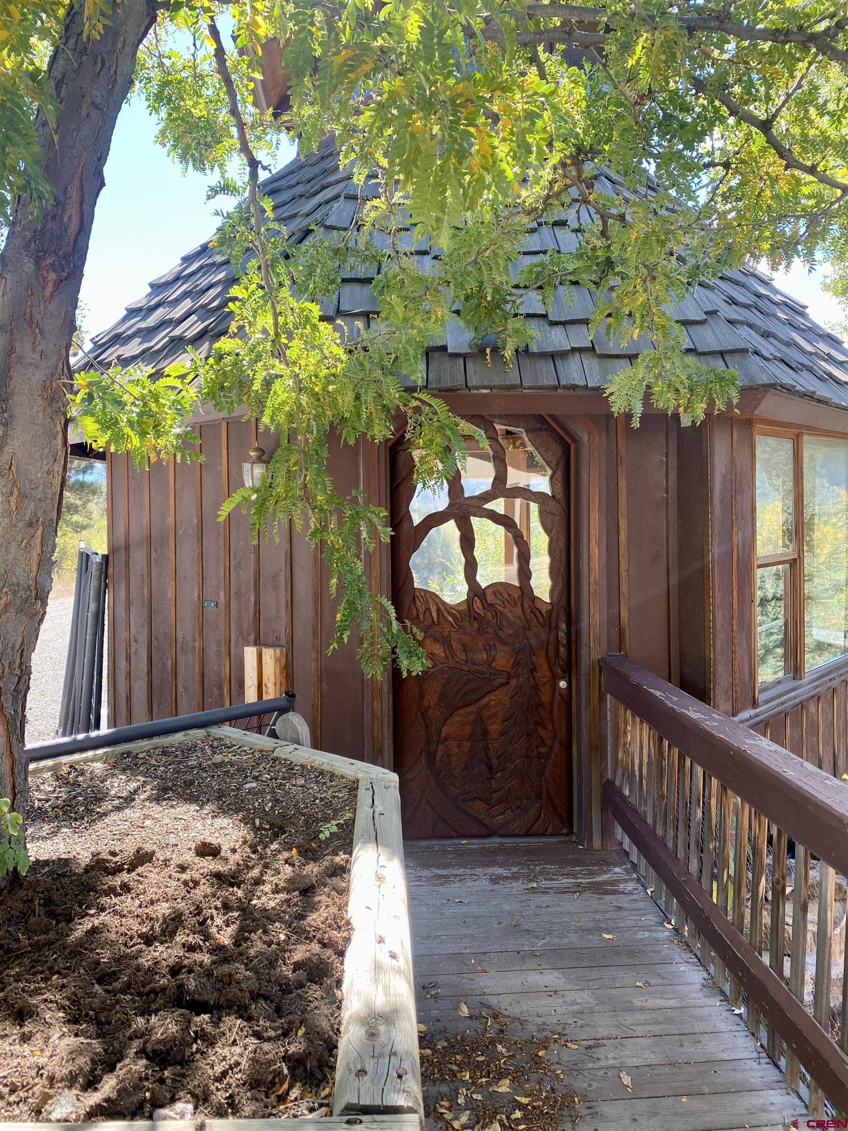 21430 Highway 550 Ridgway, CO 81432 - Photo 7 of 35 a view of a house with a small yard