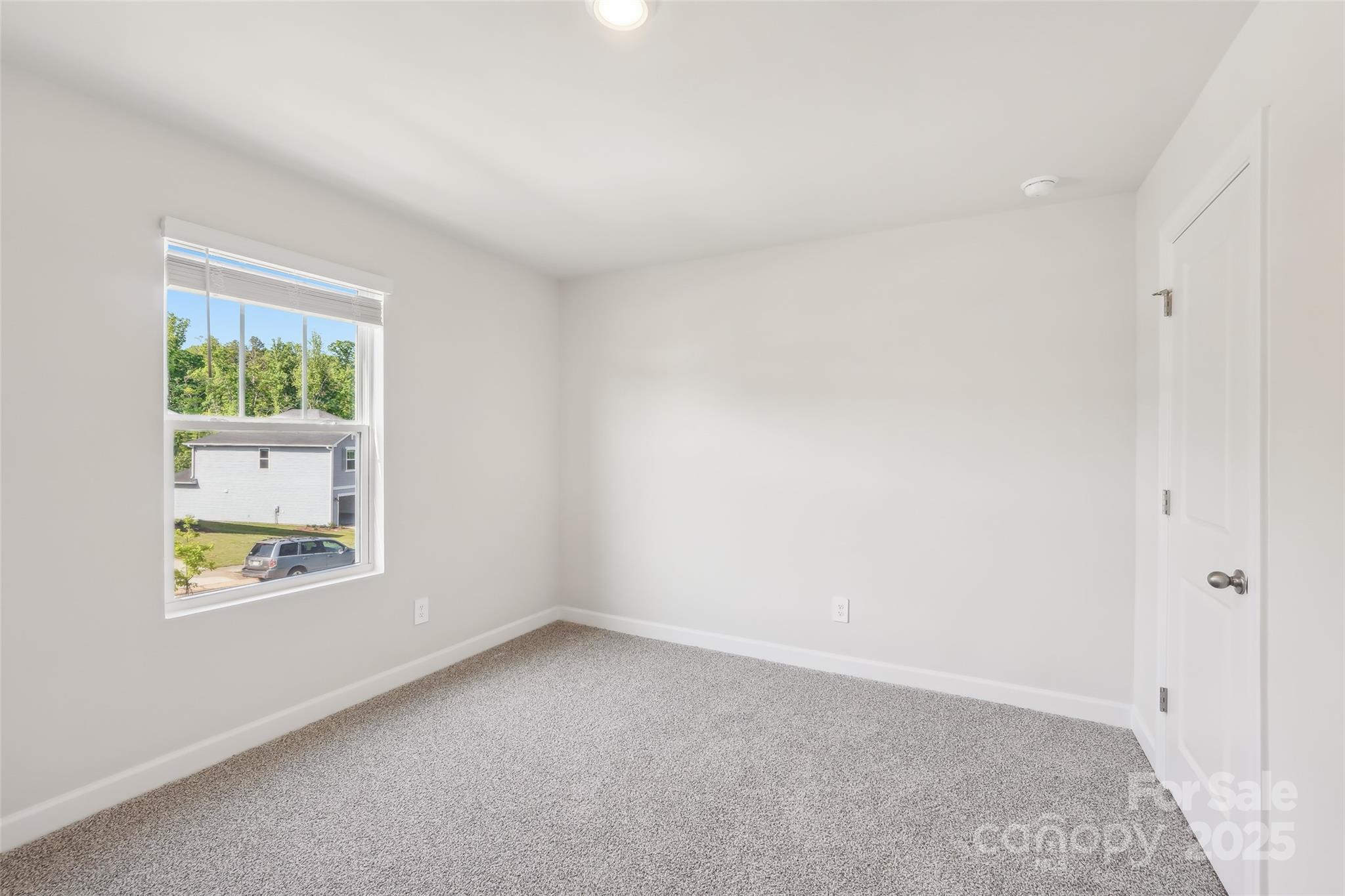 1305 30th St Lane Northeast Conover, NC 28613 - Photo 17 of 25 an empty room with a window