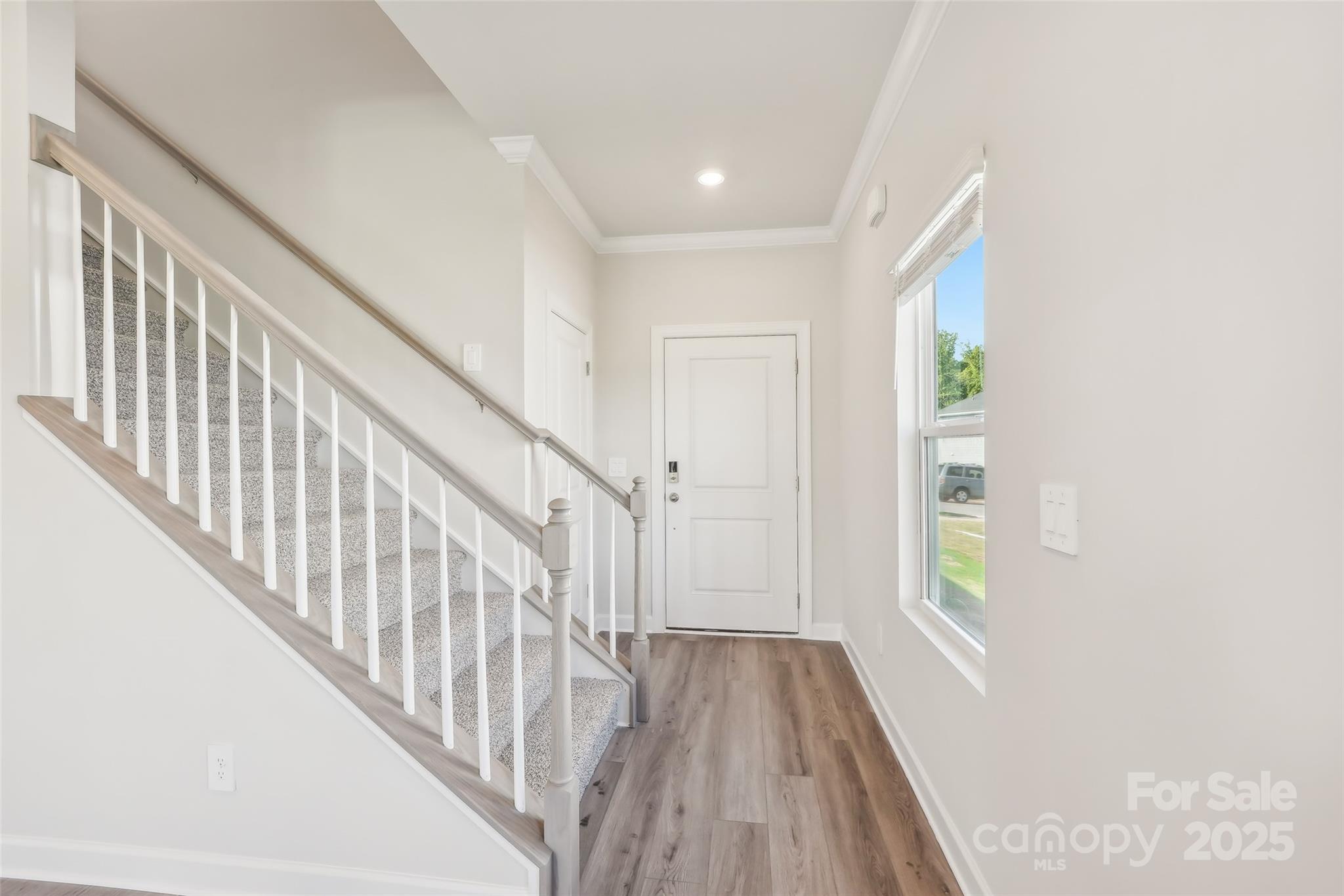 1305 30th St Lane Northeast Conover, NC 28613 - Photo 2 of 25 a view of staircase with wooden floor and fan