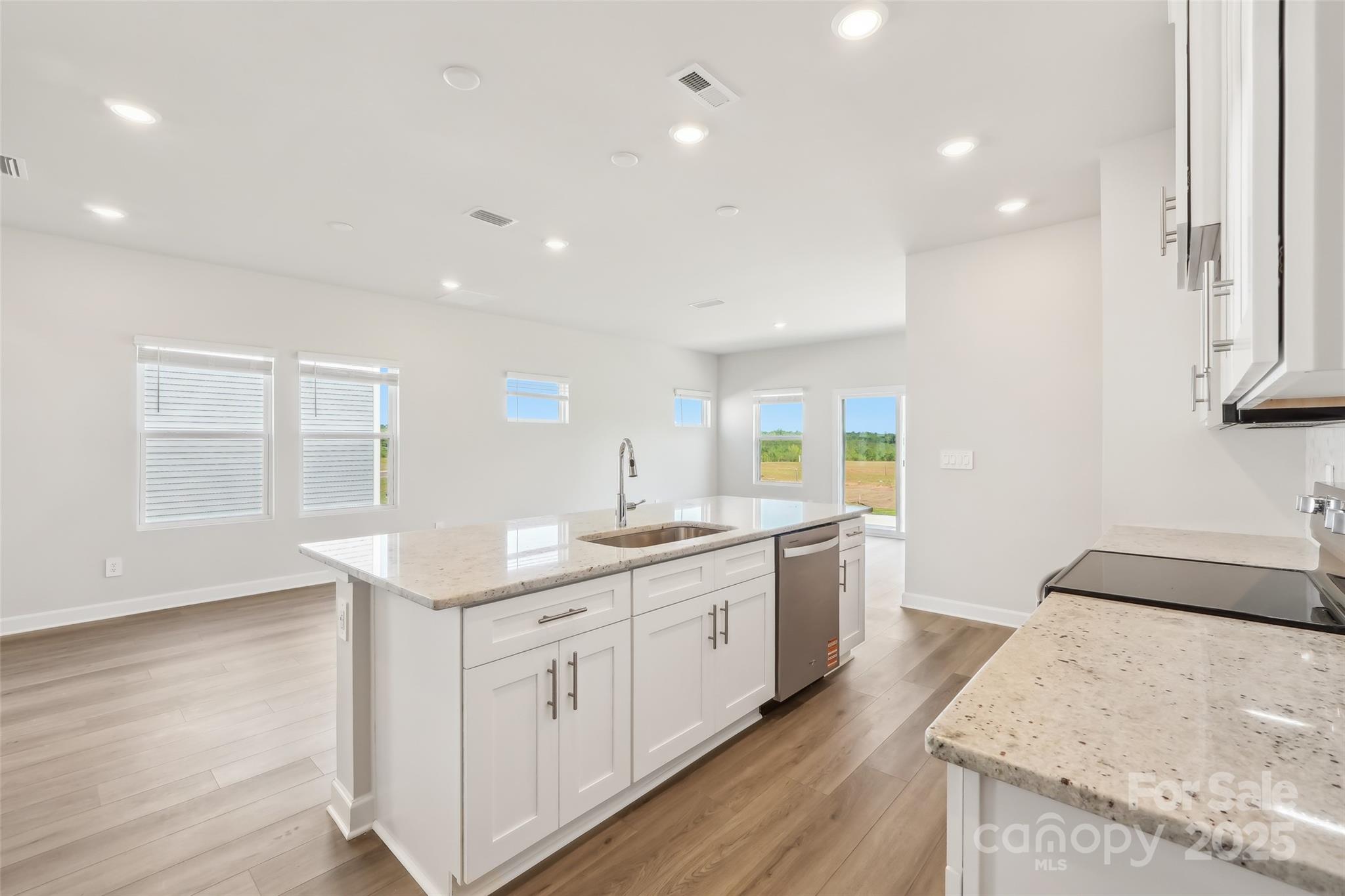 1305 30th St Lane Northeast Conover, NC 28613 - Photo 10 of 25 a kitchen with a sink stove and cabinets