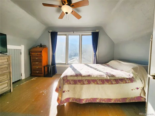 a bedroom with a bed and window