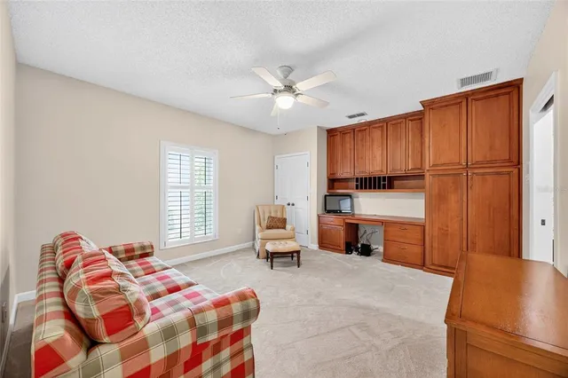 a bedroom with a bed and a chair