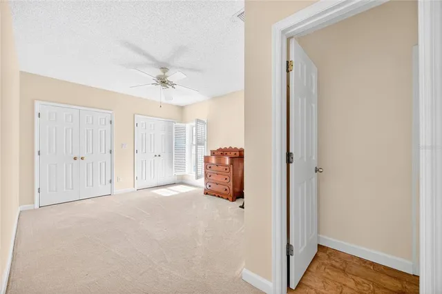 a view of livingroom with hardwood floor and ceiling fan
