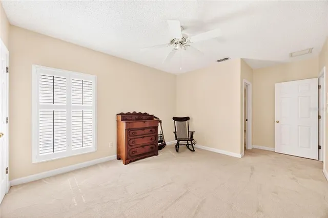 a bathroom with a sink and mirror with shower curtain