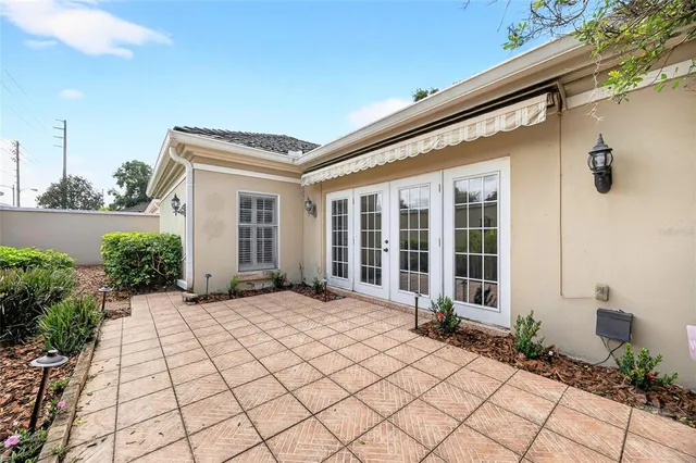 a living room with furniture and view of kitchen