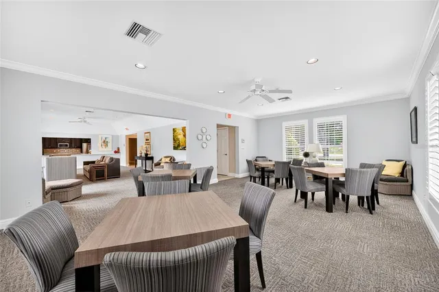 a swimming pool with outdoor seating and yard