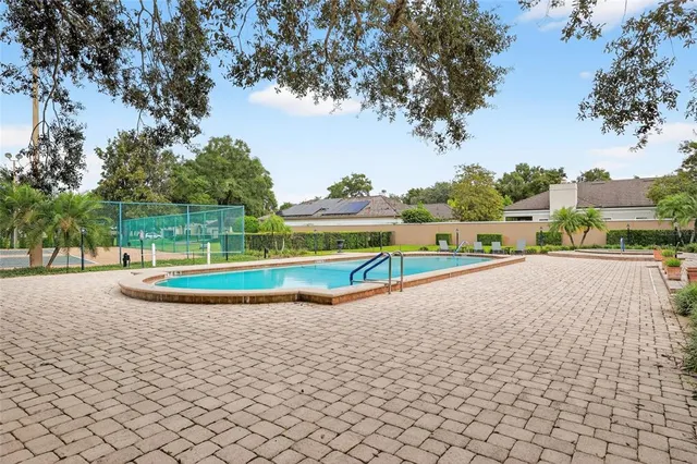 a view of a swimming pool with a yard