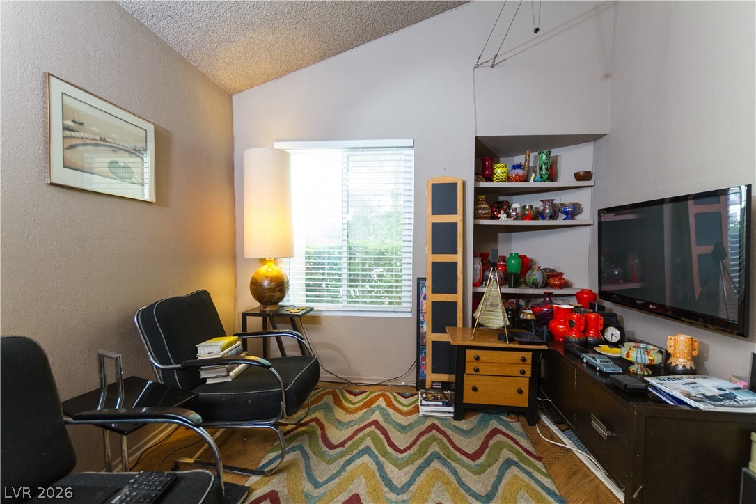 133 Coventry Circle Henderson, NV 89074 - Photo 12 of 99 Den currently being used as an office. Built-in shelving area easily converted to a closet if desire a 3rd bedroom.